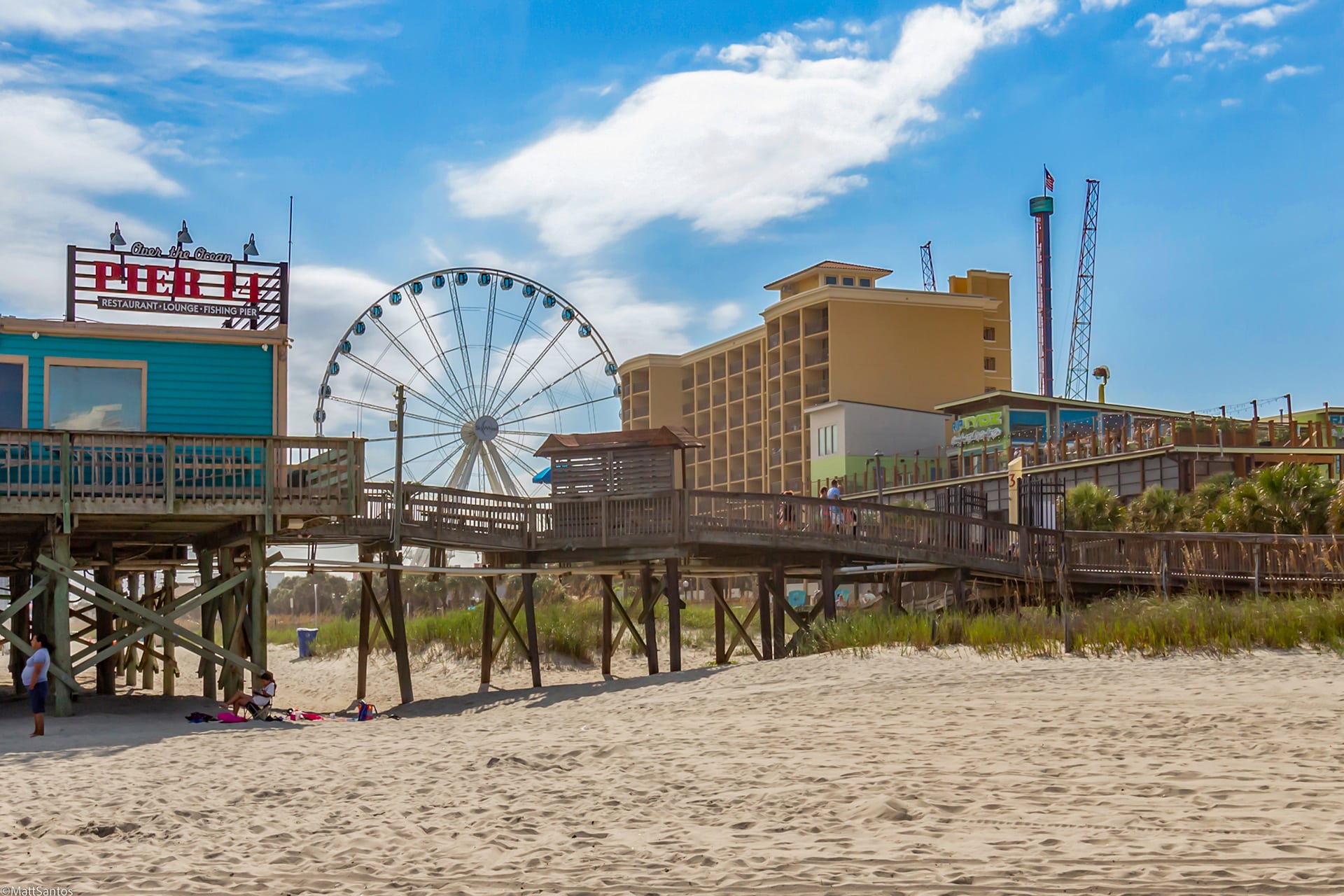 Myrtle Beach boardwalk and SkyWheel from the beach